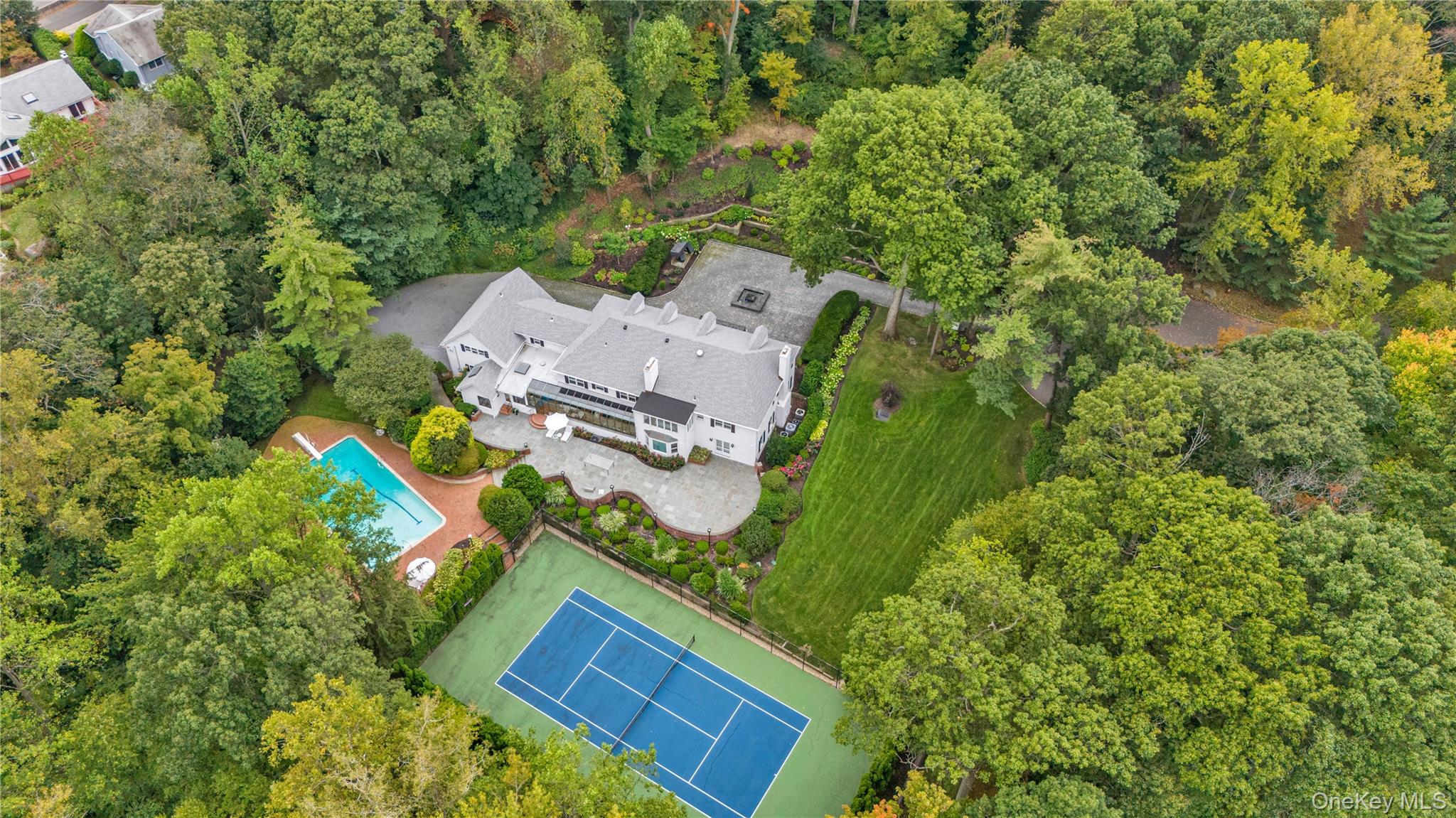 45 SE Road Sands Point, NY 11050 - Photo 27 of 36 an aerial view of a house with a yard