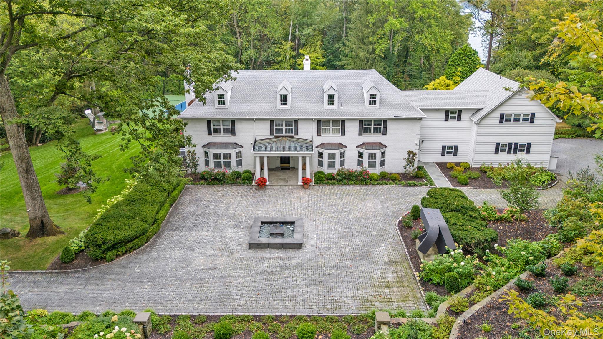 45 SE Road Sands Point, NY 11050 - Photo 35 of 36 an aerial view of a house with swimming pool and garden