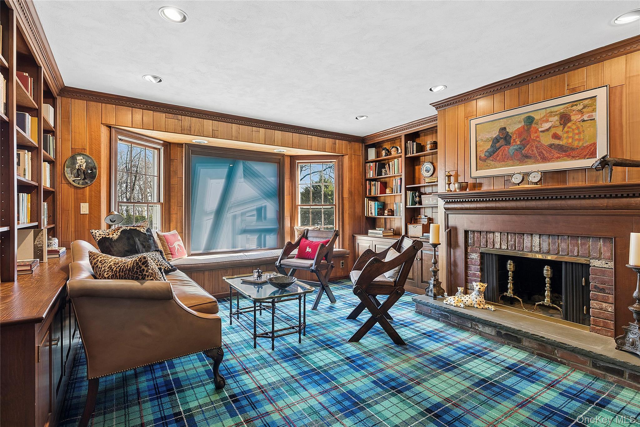 45 SE Road Sands Point, NY 11050 - Photo 8 of 36 a living room with furniture a fireplace and a flat screen tv