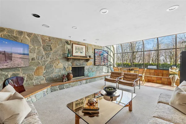 a kitchen with sink attached with living room
