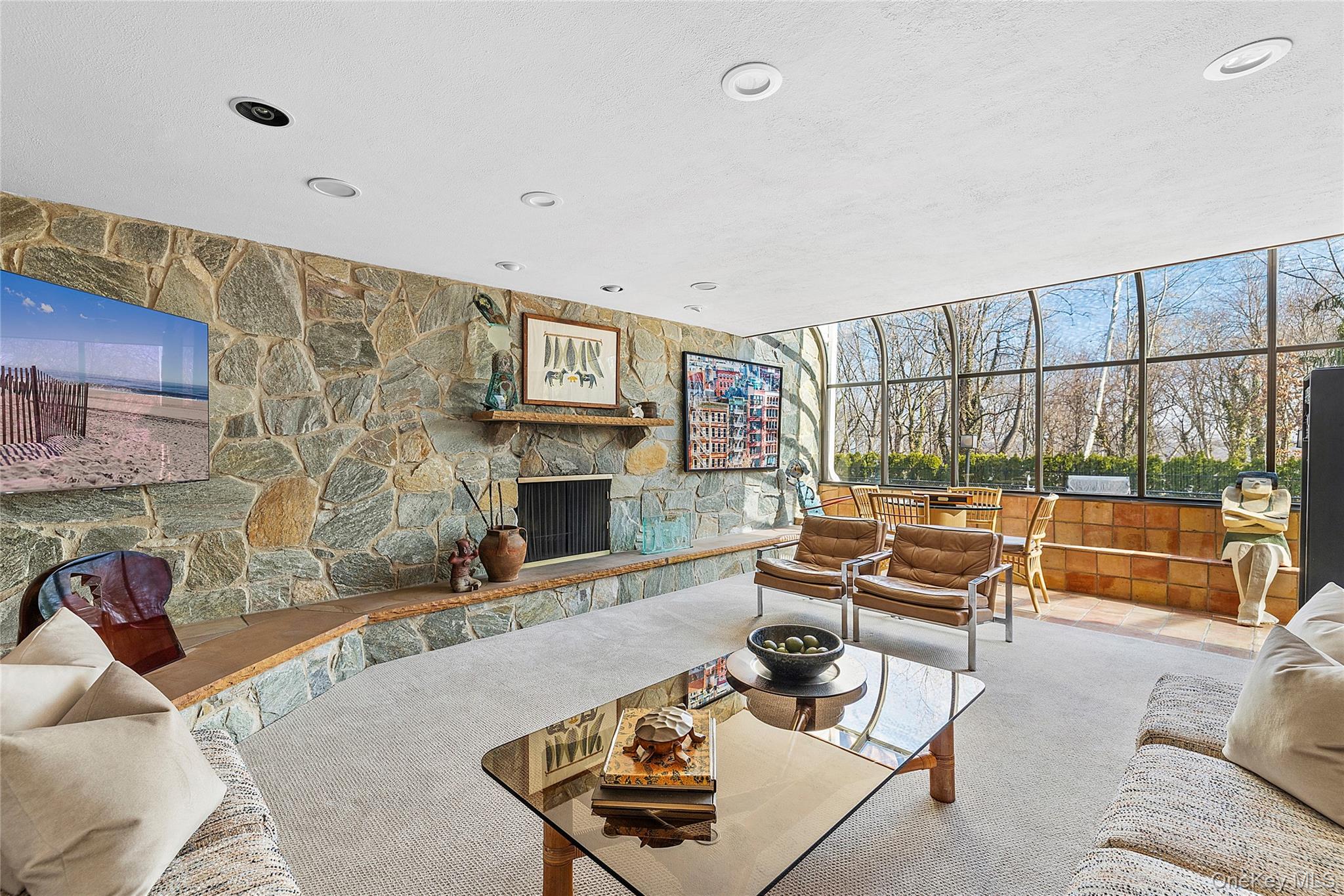 45 SE Road Sands Point, NY 11050 - Photo 10 of 36 a living room with furniture and a fireplace