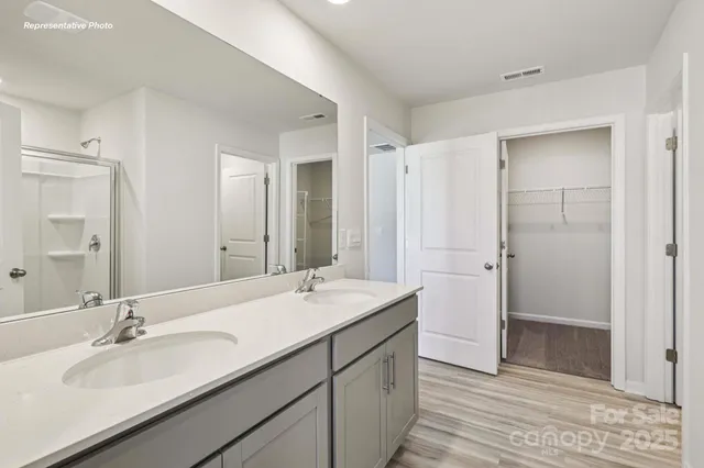 a bathroom with a double vanity sink mirror and double