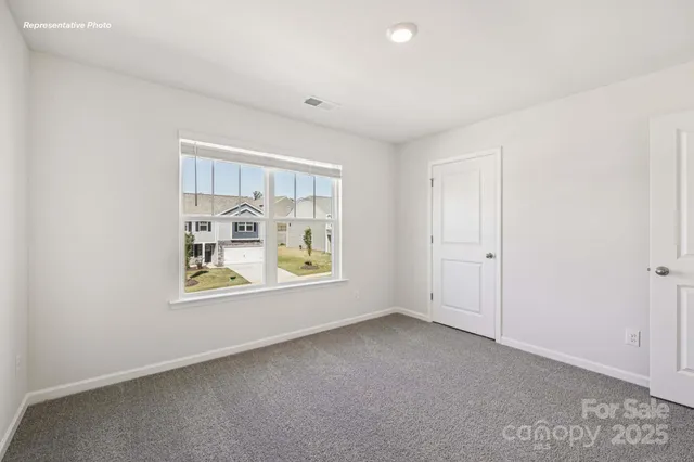 an empty room with windows and with window