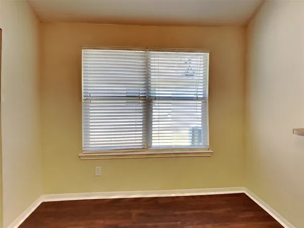 a view of a room that has a window