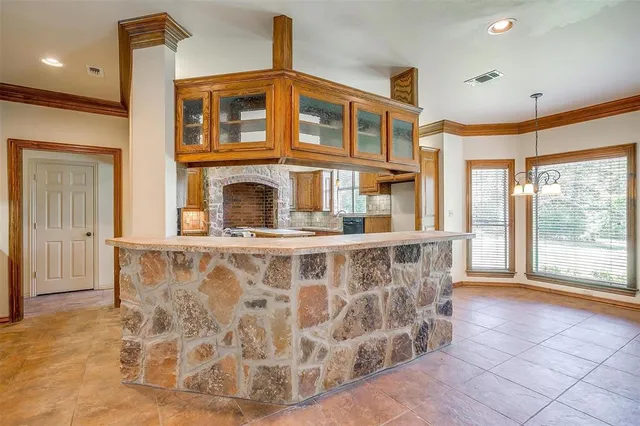 a kitchen with a stove and a refrigerator