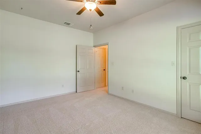 an aerial view of a houses with a garden and lake view