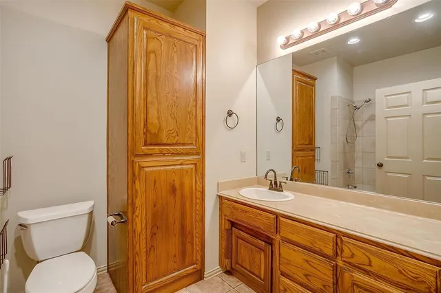 an aerial view of a residential houses with outdoor space and swimming pool