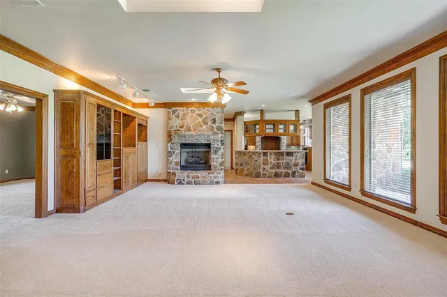 a view of an empty room with a fireplace