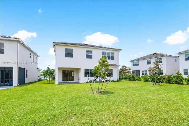 a view of a house with a back yard