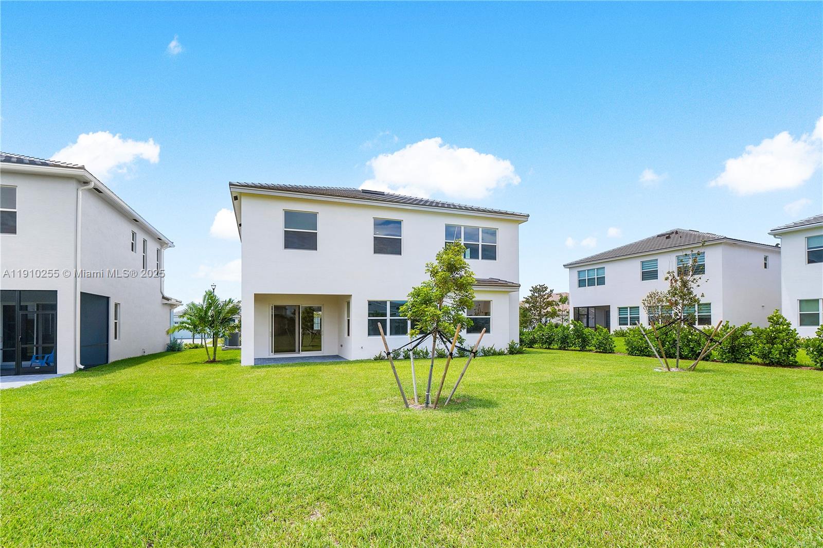 5488 Liberty Lane, Unit 5488 Westlake, FL 33470 - Photo 11 of 39 a view of a house with a back yard
