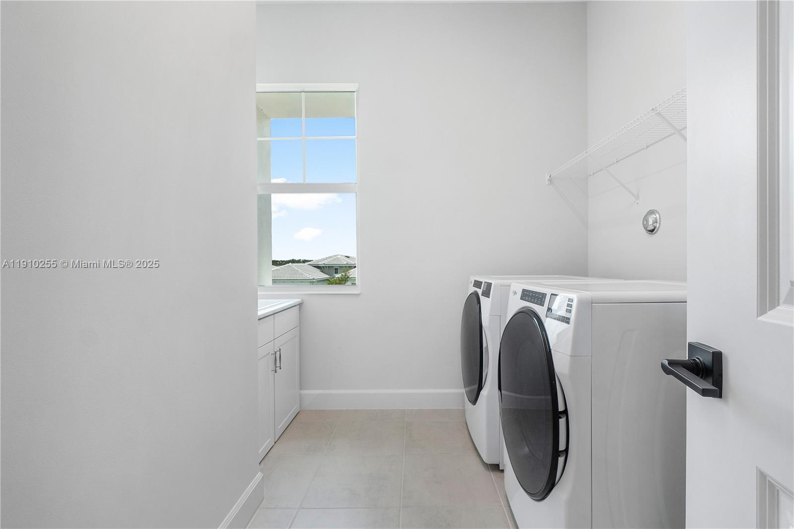 5488 Liberty Lane, Unit 5488 Westlake, FL 33470 - Photo 20 of 39 a utility room with dryer and washer
