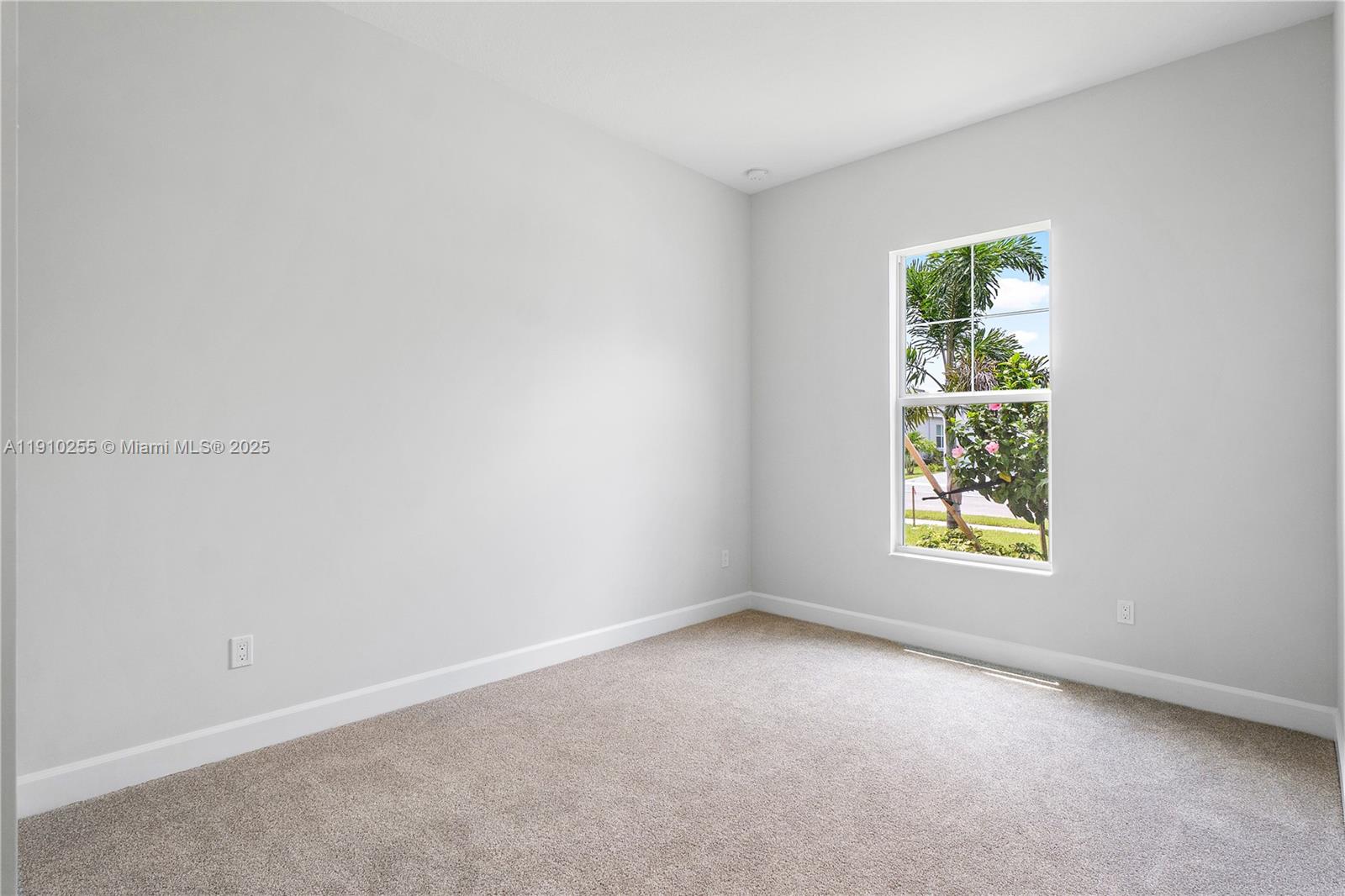 5488 Liberty Lane, Unit 5488 Westlake, FL 33470 - Photo 21 of 39 an empty room with windows