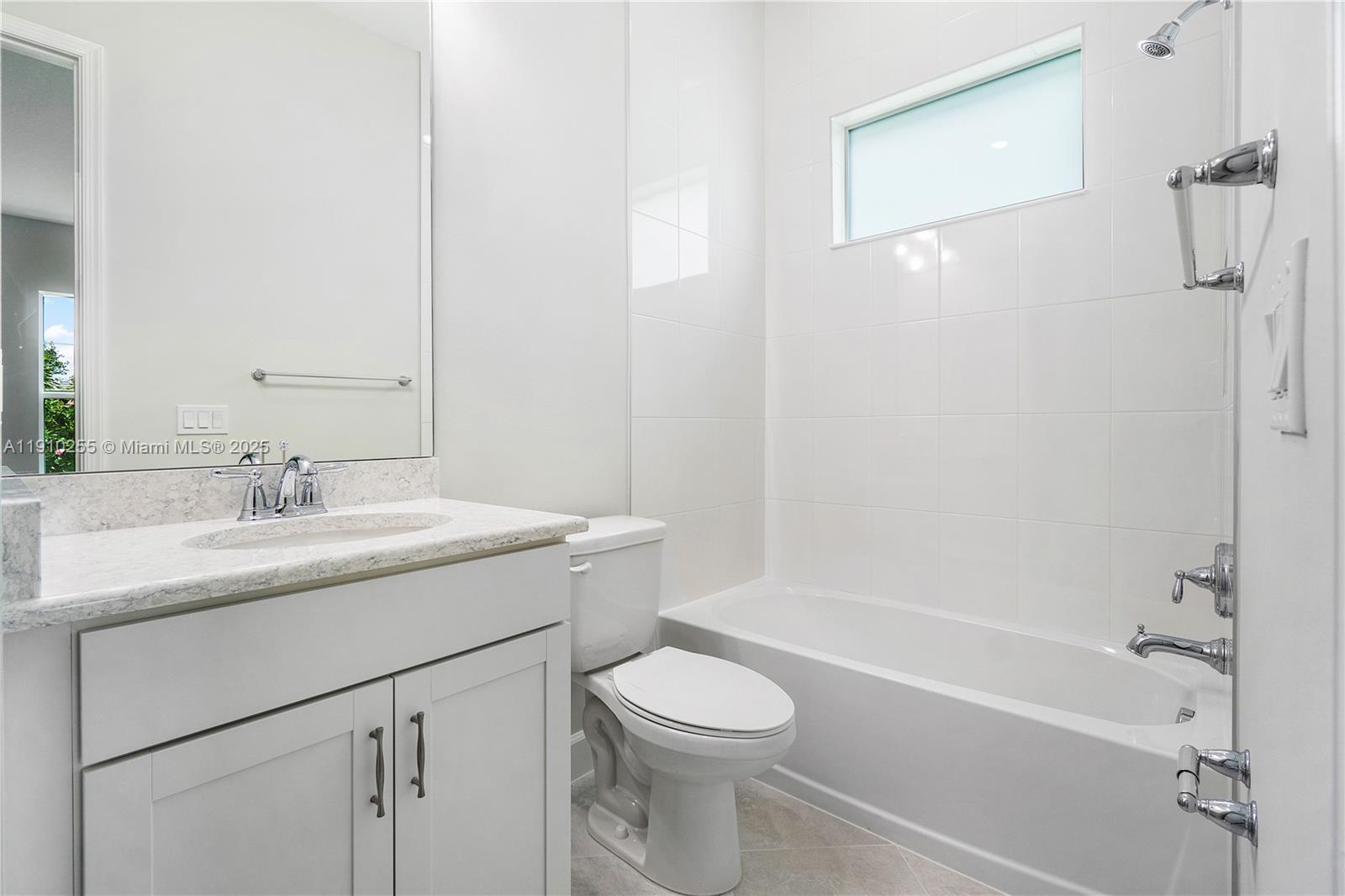 5488 Liberty Lane, Unit 5488 Westlake, FL 33470 - Photo 22 of 39 a bathroom with a granite countertop sink toilet and shower