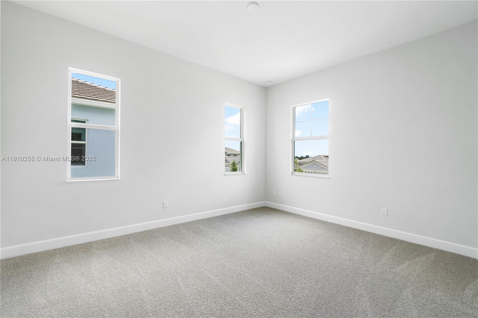 5488 Liberty Lane, Unit 5488 Westlake, FL 33470 - Photo 24 of 39 an empty room with windows