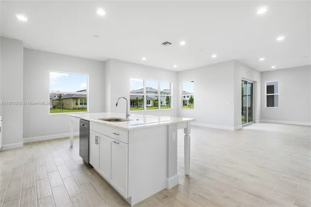 a kitchen with stove and cabinets