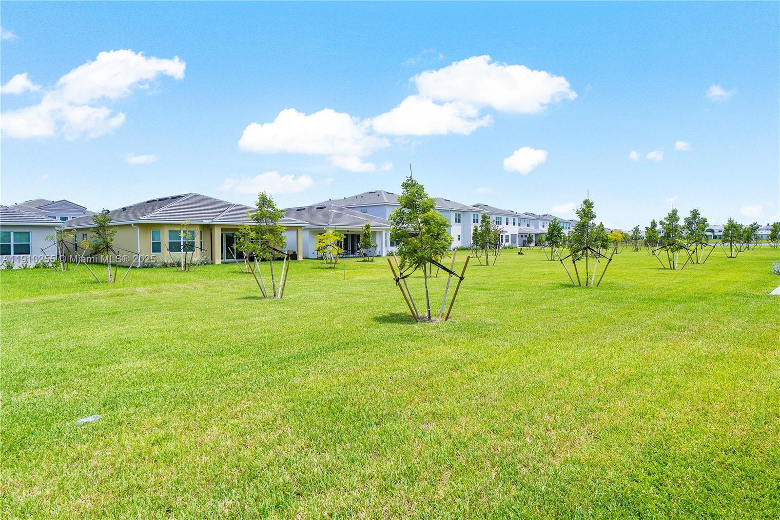 5488 Liberty Lane, Unit 5488 Westlake, FL 33470 - Photo 5 of 39 a view of a big yard with a swimming pool
