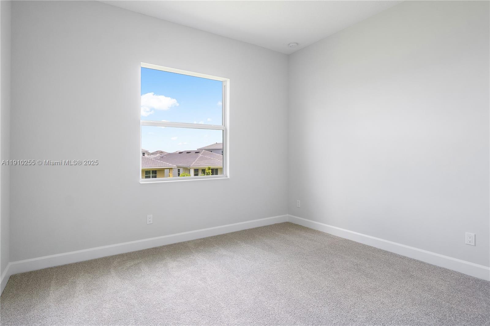 5488 Liberty Lane, Unit 5488 Westlake, FL 33470 - Photo 8 of 39 an empty room with a window