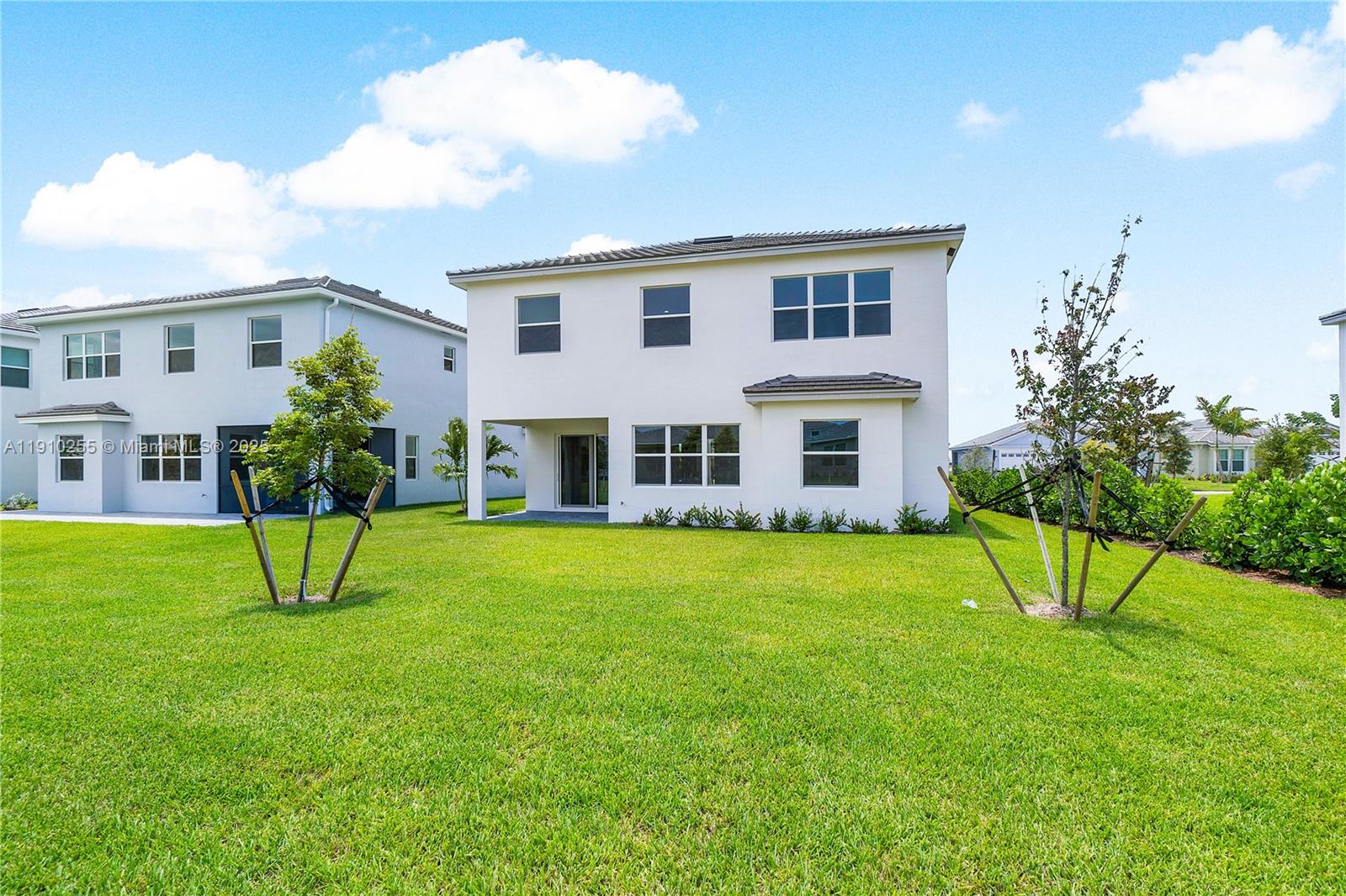 5488 Liberty Lane, Unit 5488 Westlake, FL 33470 - Photo 9 of 39 a view of house with a yard