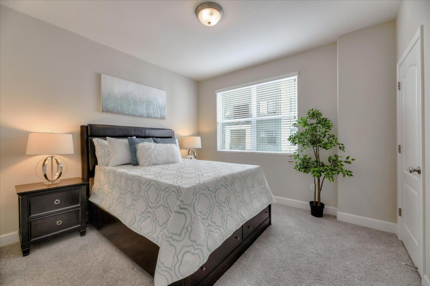131 Hudson Place San Jose, CA 95123 - Photo 11 of 16 a bedroom with a bed and a potted plant