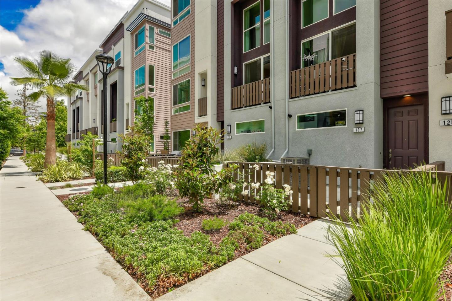 131 Hudson Place San Jose, CA 95123 - Photo 2 of 16 a front view of a house with a garden