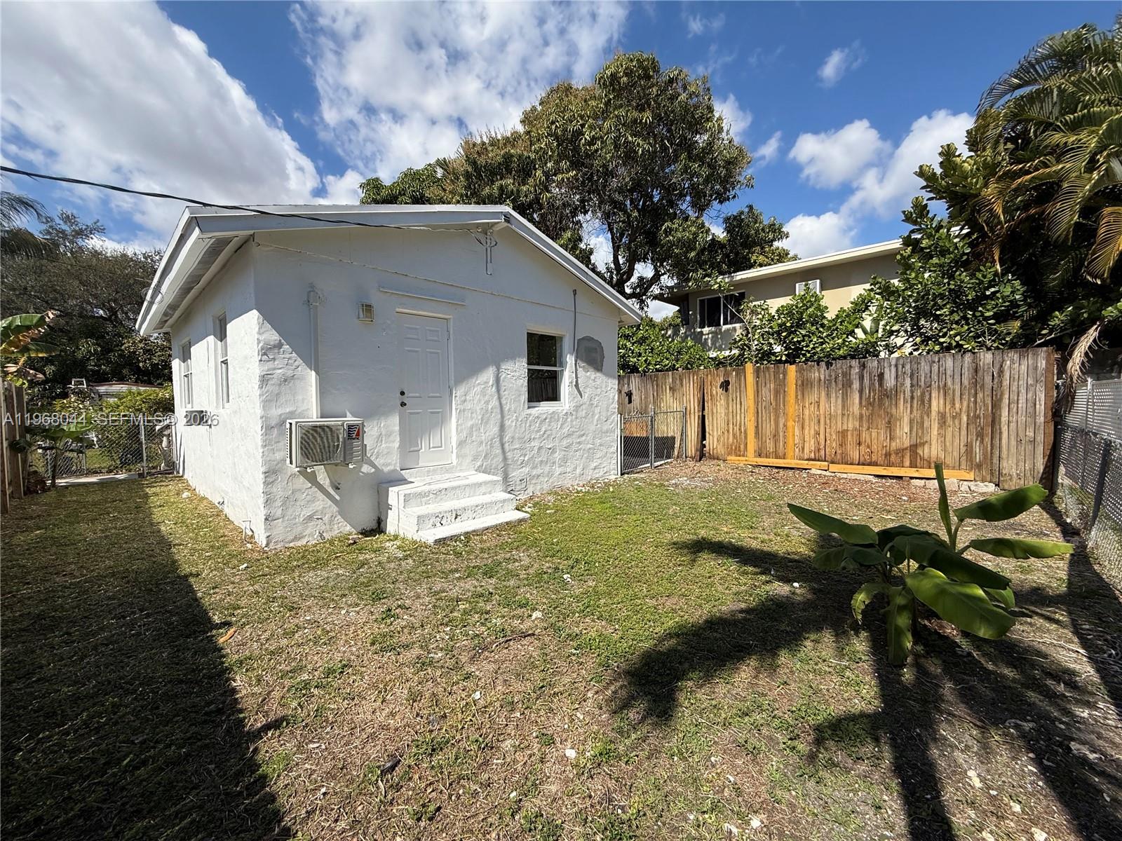 2801 Southwest 26th Street, Unit RLEFT Miami, FL 33133 - Photo 1 of 10 a view of backyard of the house