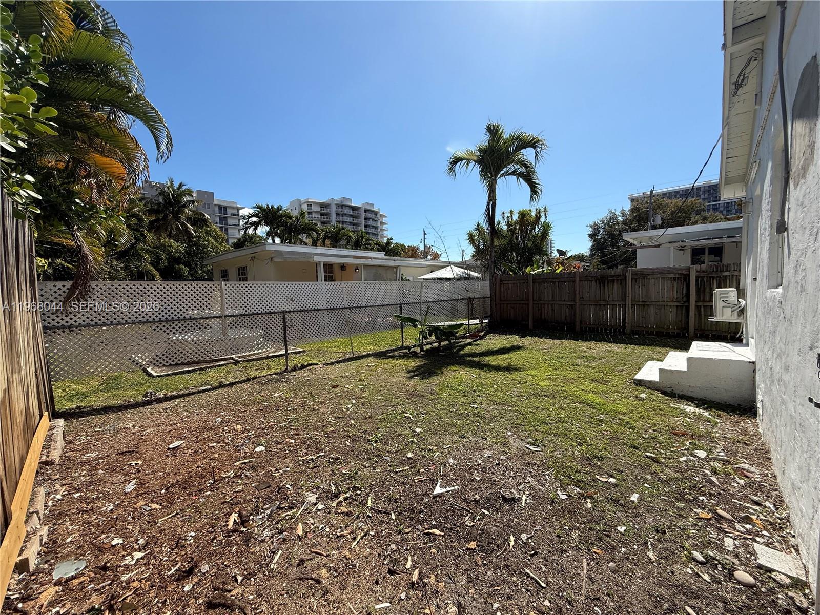 2801 Southwest 26th Street, Unit RLEFT Miami, FL 33133 - Photo 10 of 10 a view of a backyard with potted plants