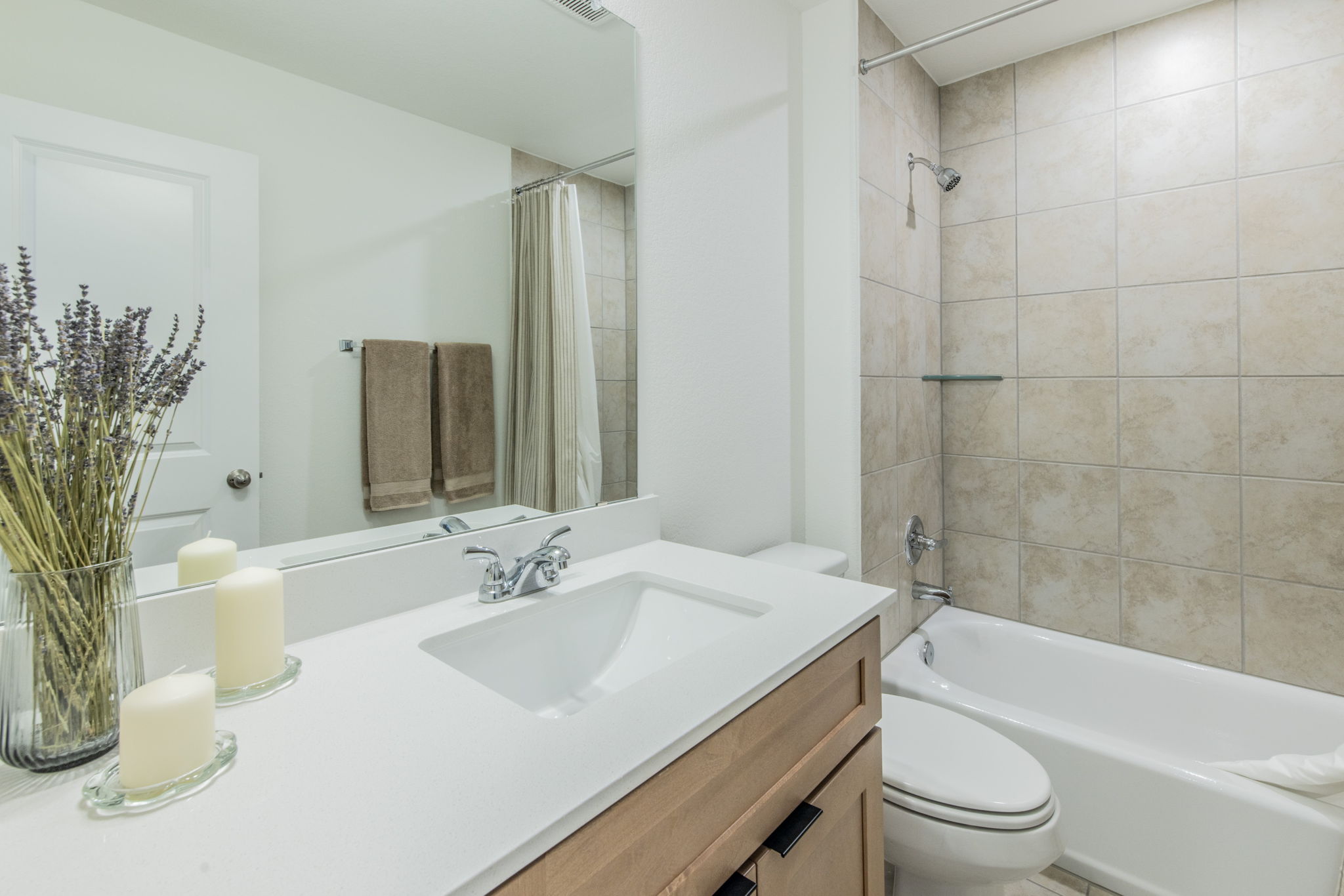 593 Backstays Loop Kyle, TX 78640 - Photo 16 of 26 a bathroom with a bathtub shower sink vanity mirror and toilet