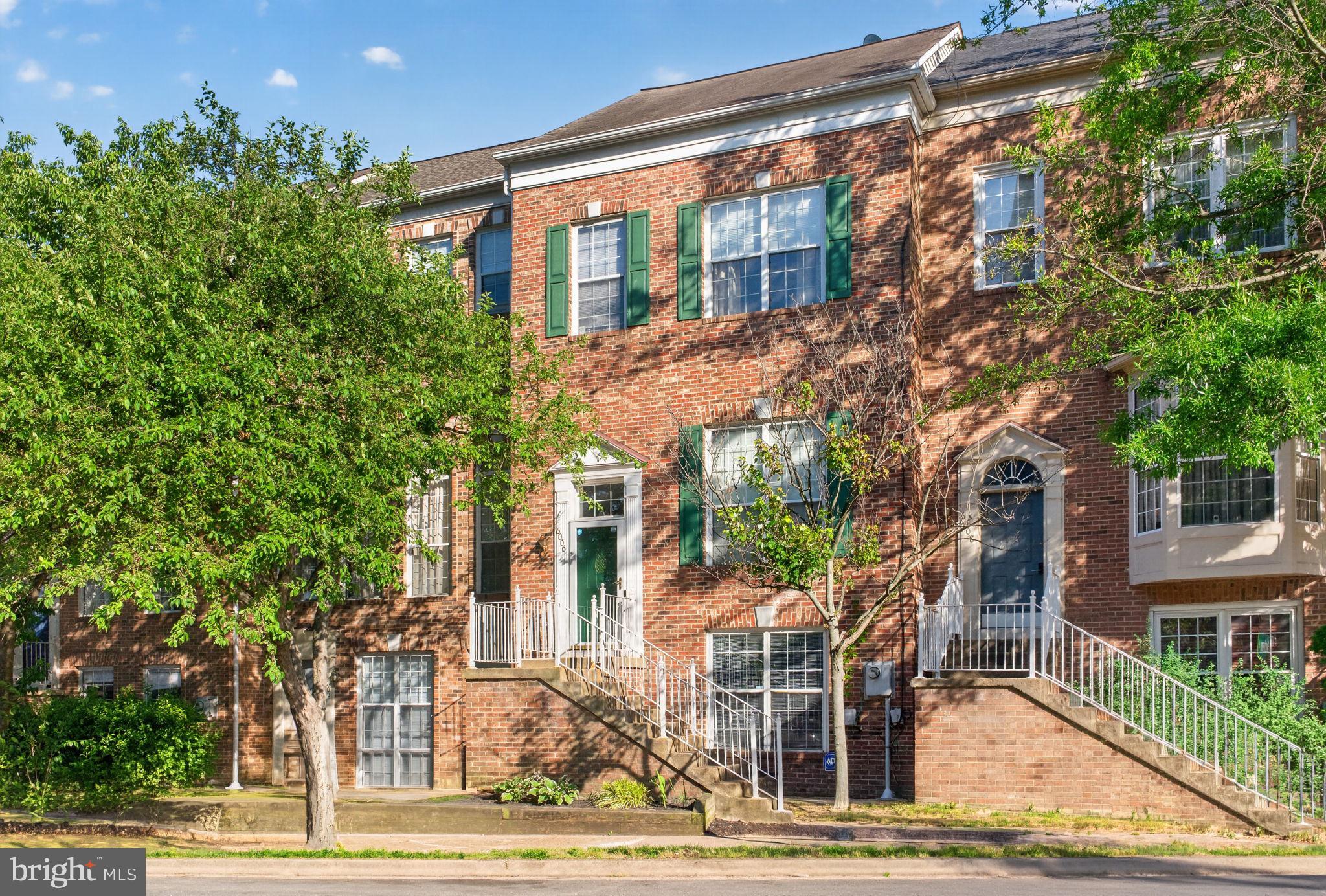 6006 Lincolnia Road Alexandria, VA 22312 - Photo 1 of 42 Charming brick townhouse with greenery.