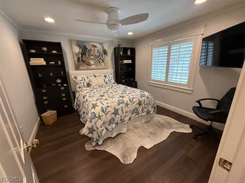 549 7th Avenue North Naples, FL 34102 - Photo 15 of 19 a bed sitting in a bedroom next to a window