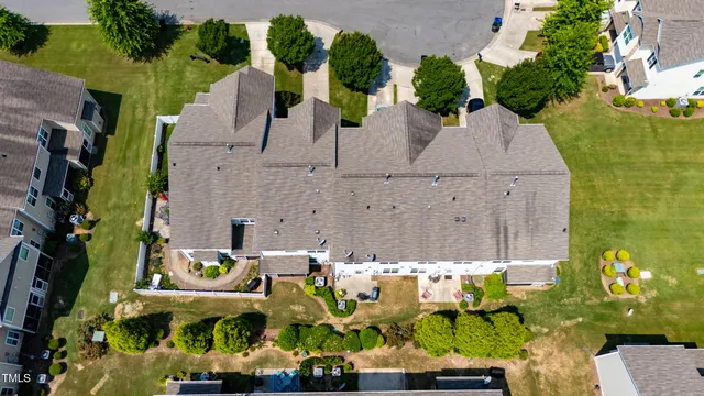 an aerial view of houses with outdoor space