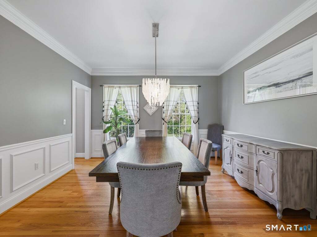 15 Fox Ridge Lane Hebron, CT 06248 - Photo 19 of 40 Crown molding, wainscoting and a beautiful chandelier!
