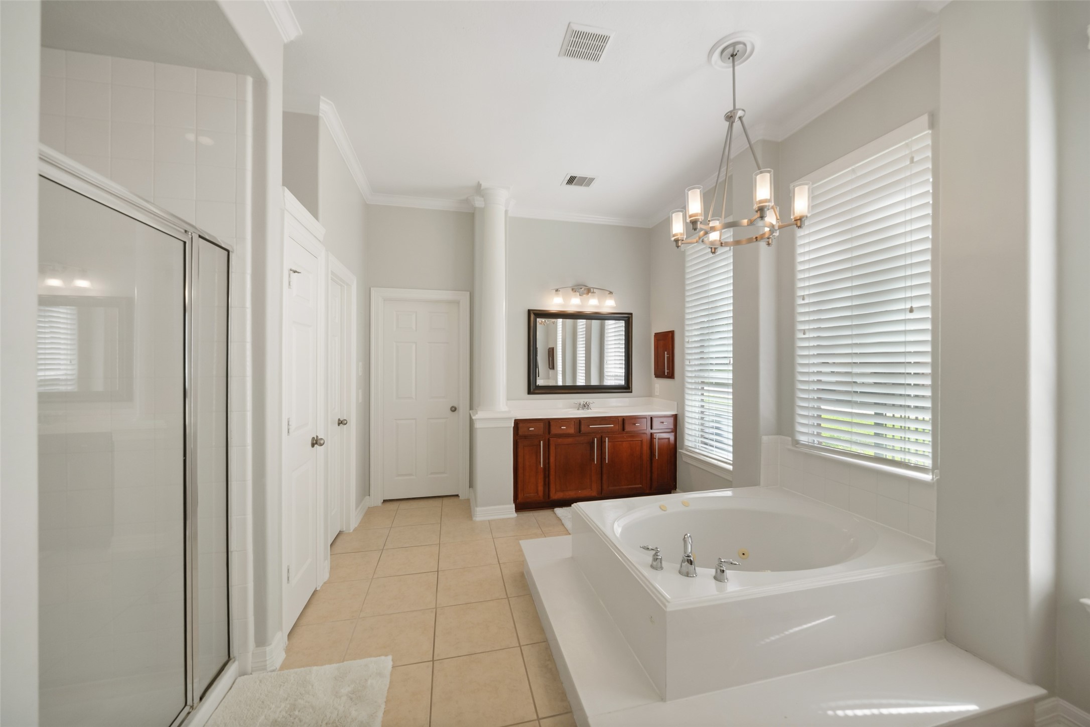 2302 Legends Shore Drive Spring, TX 77386 - Photo 32 of 48 Spacious primary bath featuring dual vanities, a soaking tub, and a separate shower.