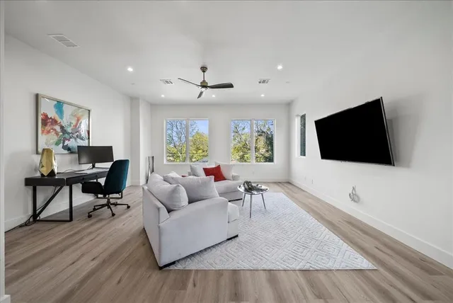 a bedroom with a bed and a table