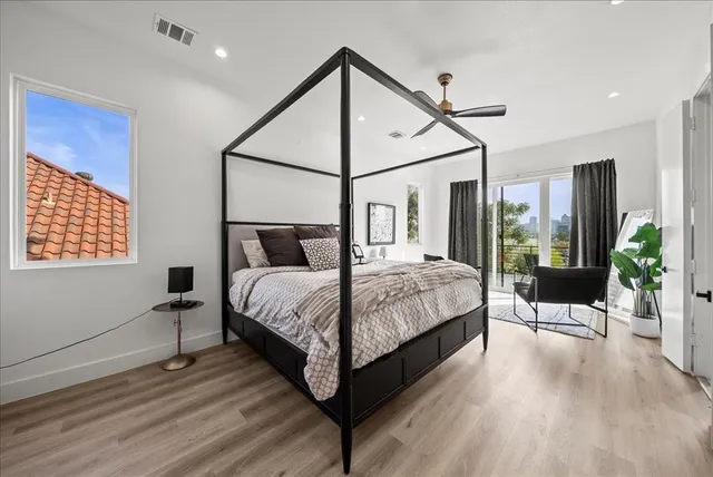 a living room with furniture flowerpot and a potted plant