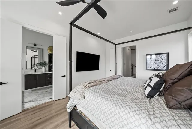 a bathroom with a double vanity sink a mirror and shower