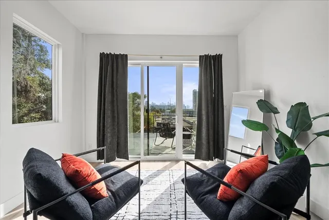 a large bathroom with a double vanity sink mirror and bathtub
