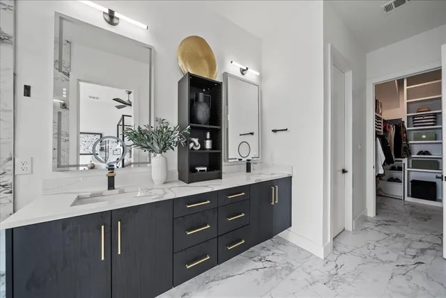 a view of a chairs and table in the balcony