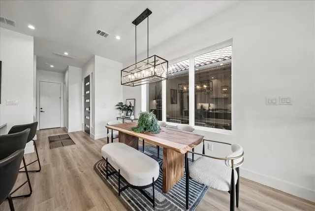 a kitchen with stainless steel appliances granite countertop a sink and cabinets
