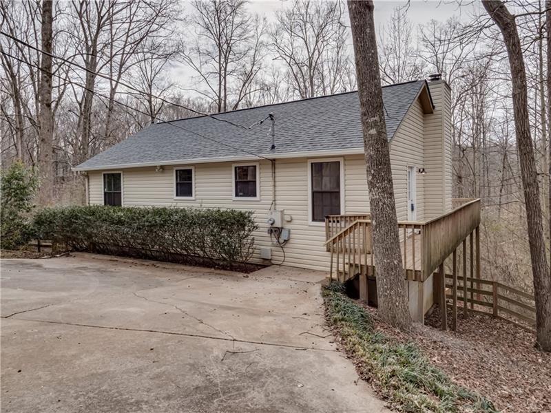 6565 Akins Way Cumming, GA 30041 - Photo 1 of 1 a house view with a outdoor space