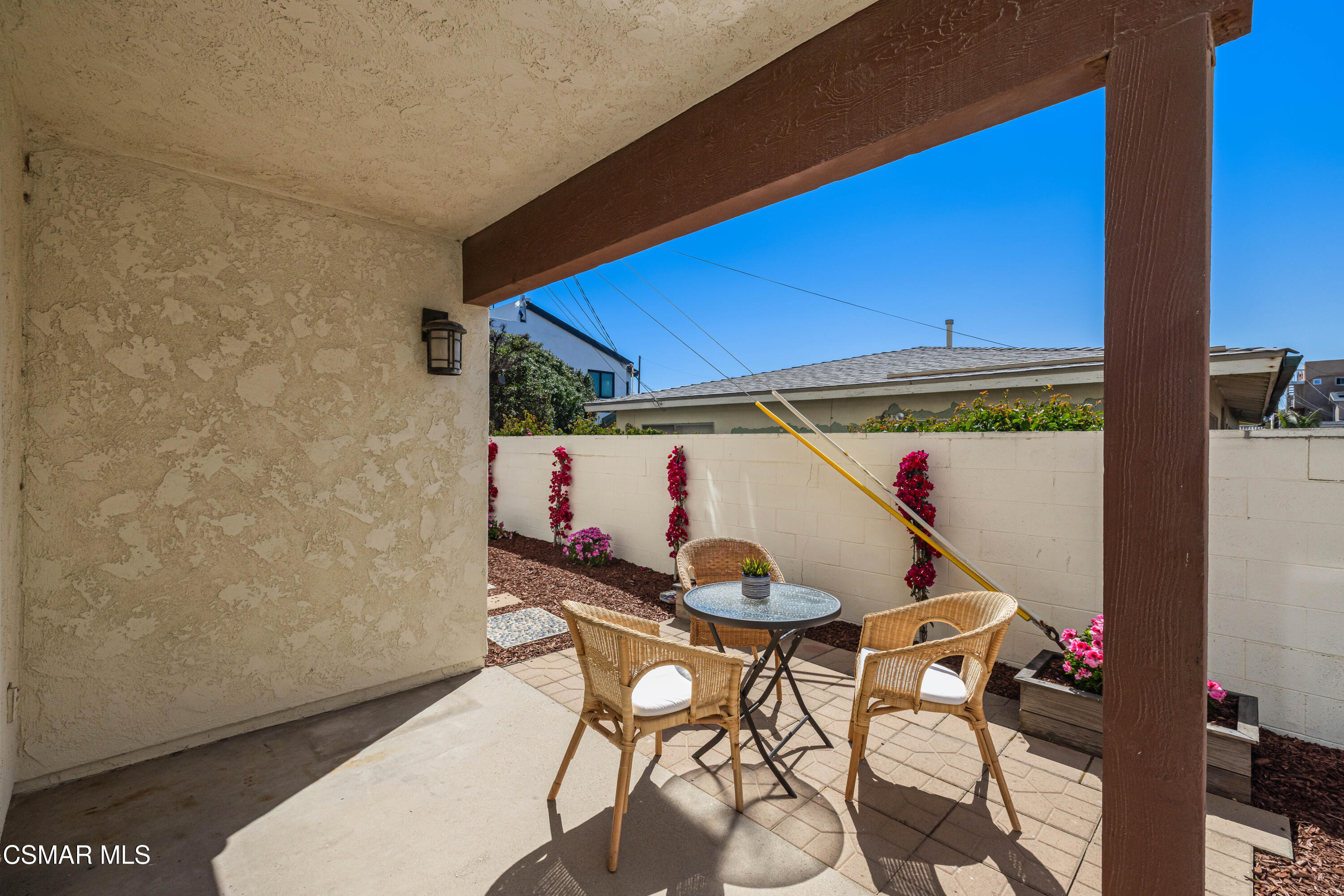 108 Pasadena Avenue Oxnard, CA 93035 - Photo 21 of 29 a view of a patio with table and chairs with wooden floor