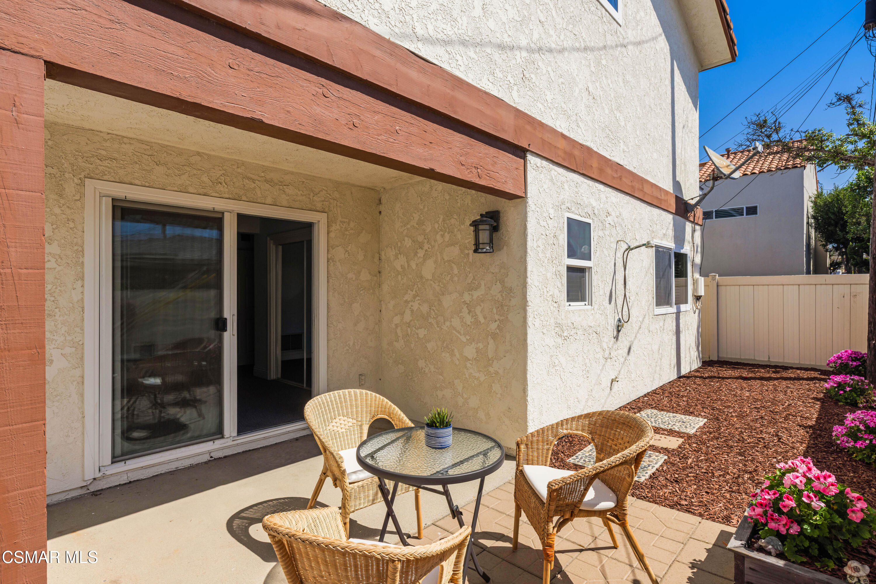 108 Pasadena Avenue Oxnard, CA 93035 - Photo 22 of 29 a backyard of a house with table and chairs