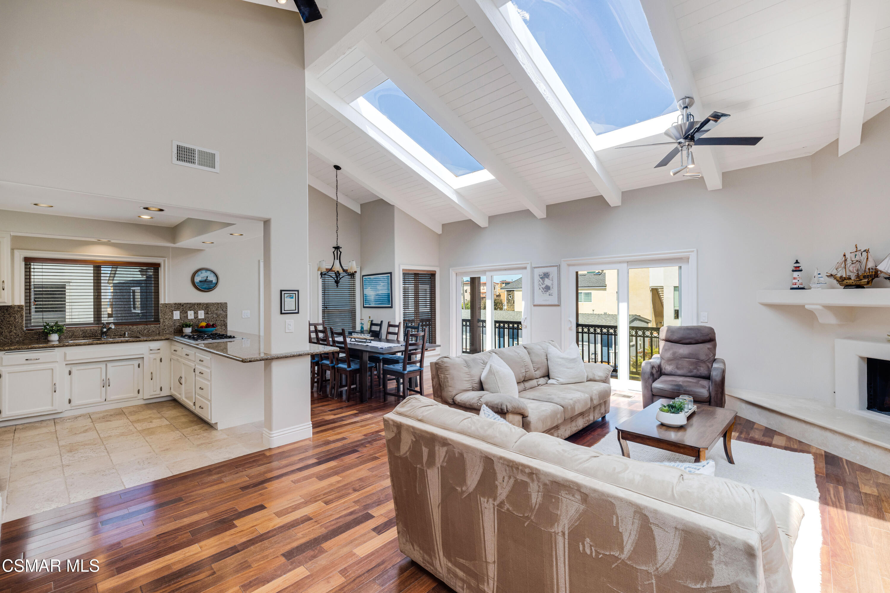 108 Pasadena Avenue Oxnard, CA 93035 - Photo 5 of 29 a large living room with stainless steel appliances kitchen island granite countertop furniture and a kitchen view