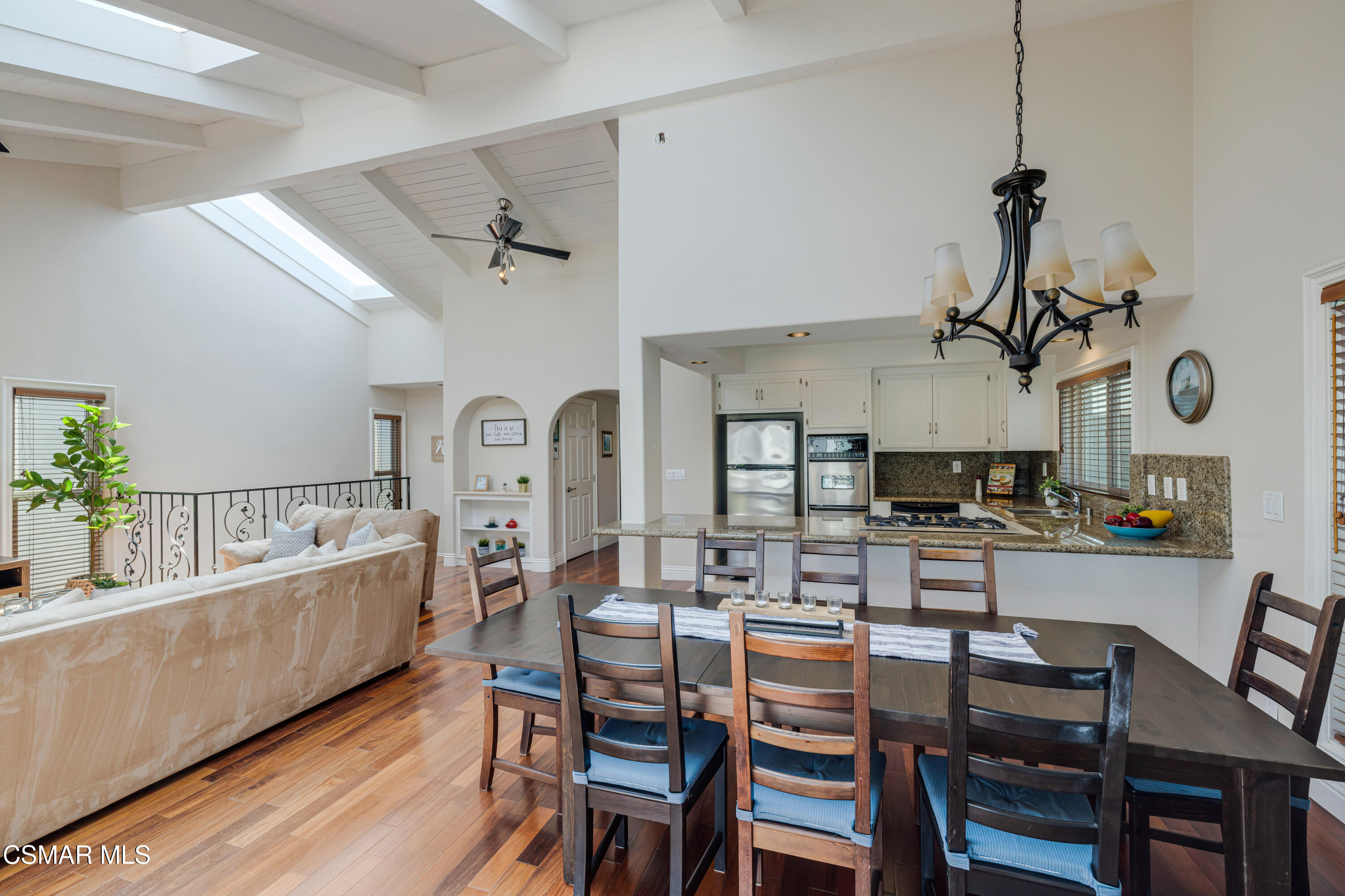 108 Pasadena Avenue Oxnard, CA 93035 - Photo 6 of 29 a view of a dining room with furniture and a chandelier