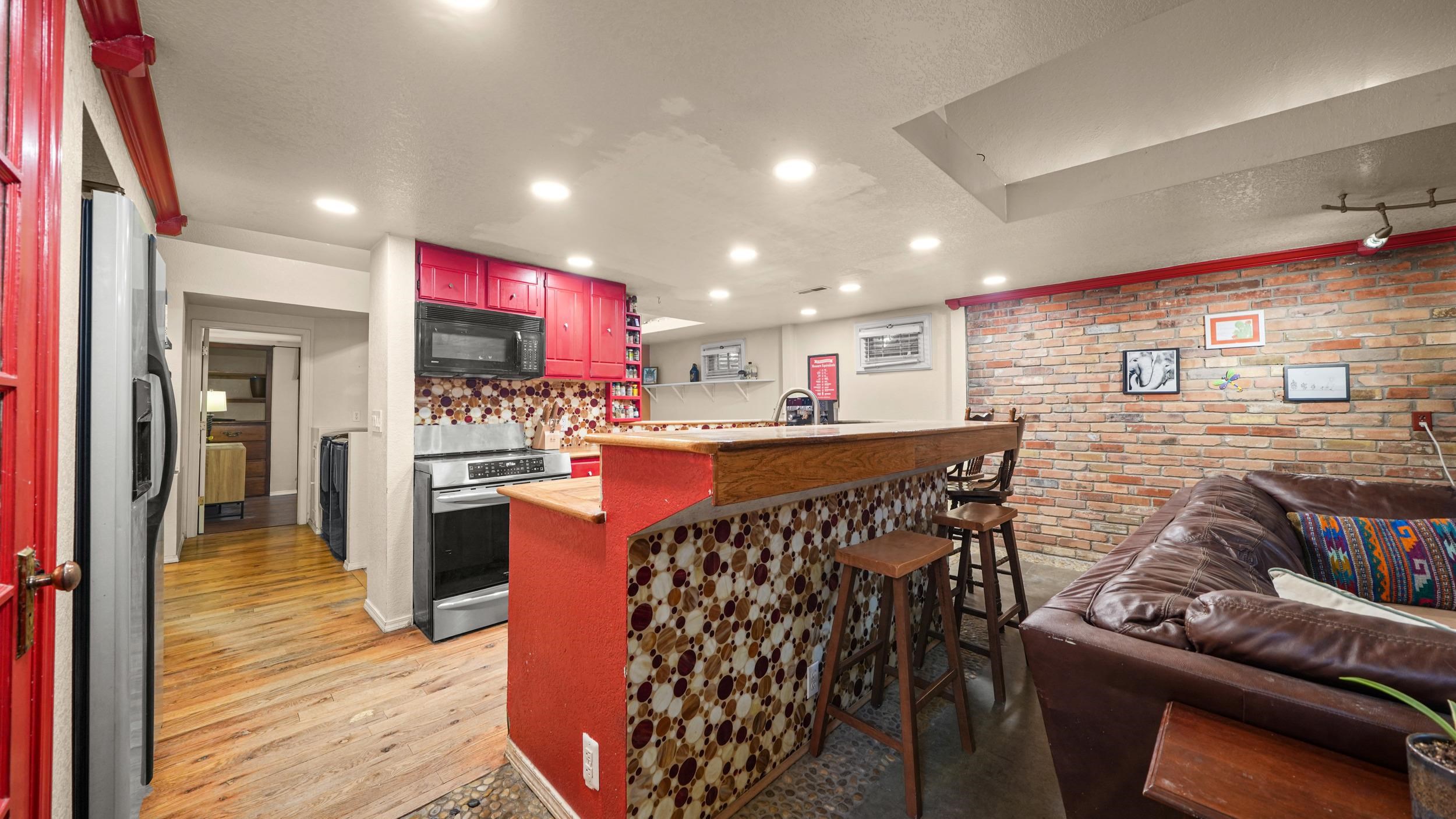 2518 D Road Grand Junction, CO 81507 - Photo 11 of 42 a kitchen with stainless steel appliances kitchen island granite countertop a stove a sink and a refrigerator