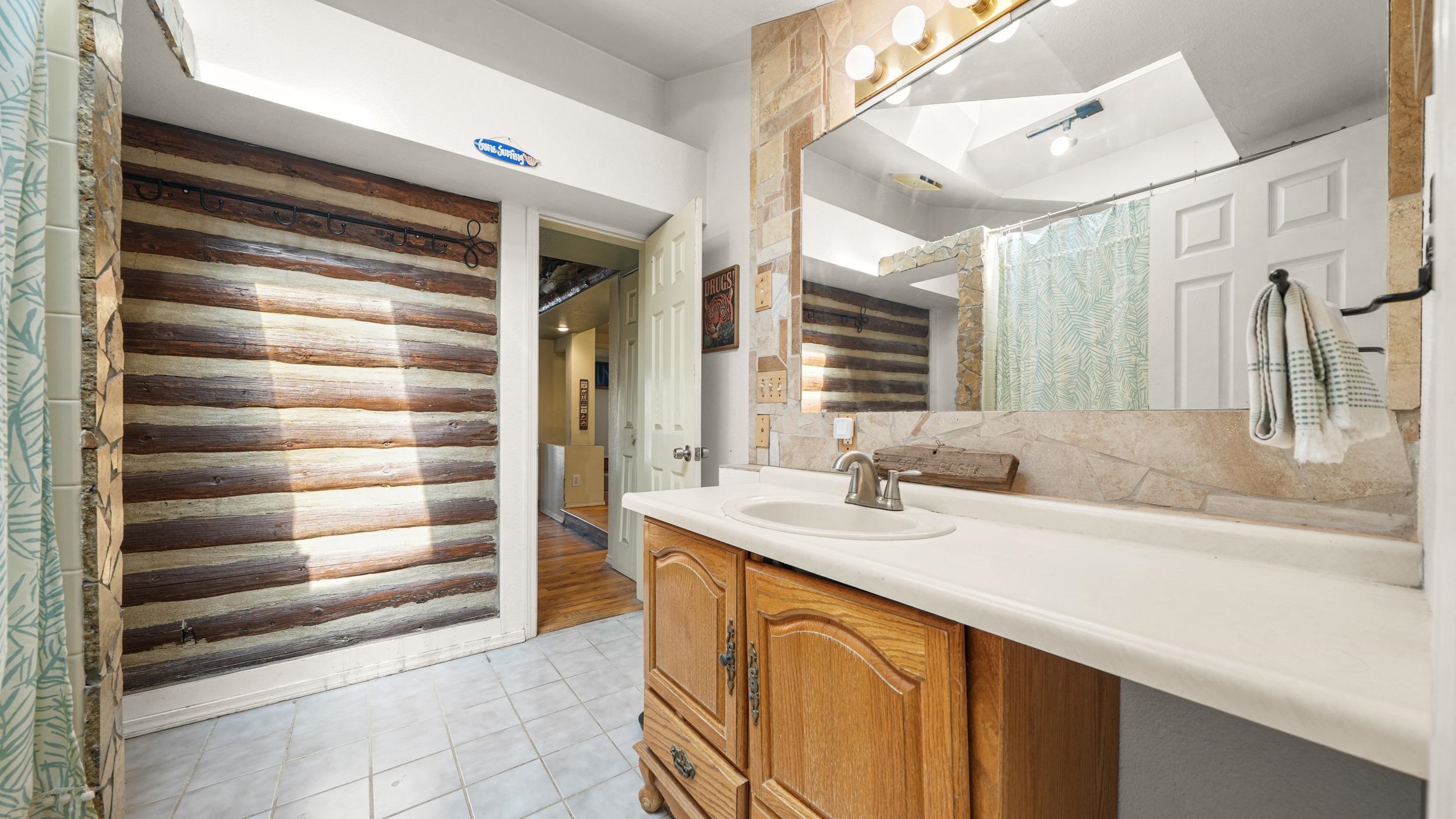 2518 D Road Grand Junction, CO 81507 - Photo 20 of 42 a bathroom with a granite countertop sink and a mirror