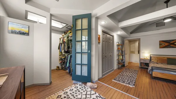 a view of hallway with furniture and a rug