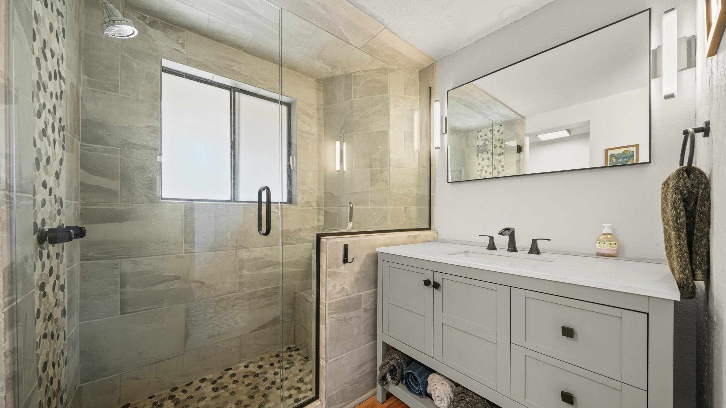 2518 D Road Grand Junction, CO 81507 - Photo 25 of 42 a bathroom with a double vanity sink a toilet and a mirror