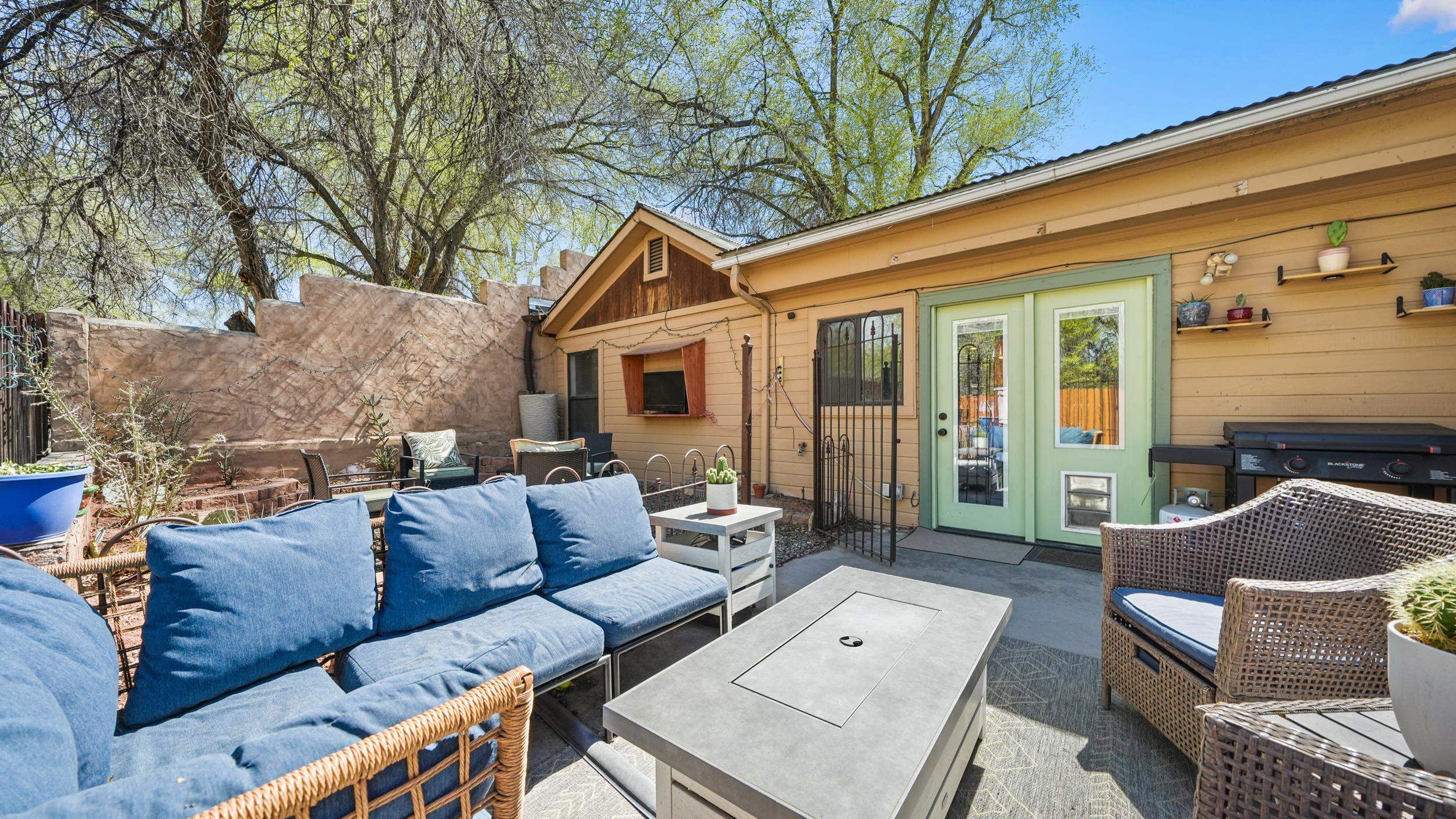 2518 D Road Grand Junction, CO 81507 - Photo 28 of 42 a view of a patio with couches chairs and a fire pit