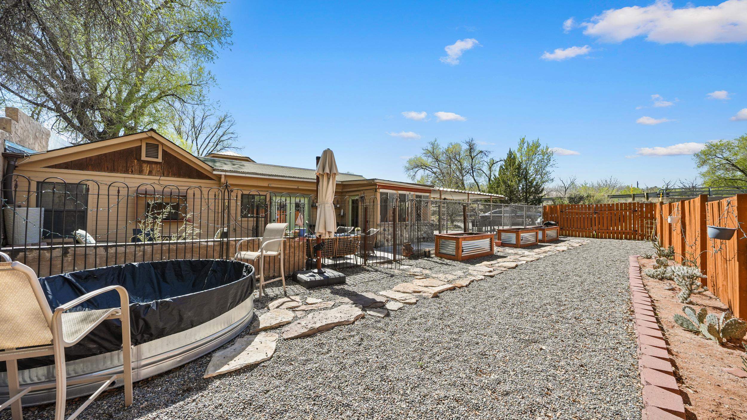 2518 D Road Grand Junction, CO 81507 - Photo 32 of 42 a view of a house with swimming pool and sitting area