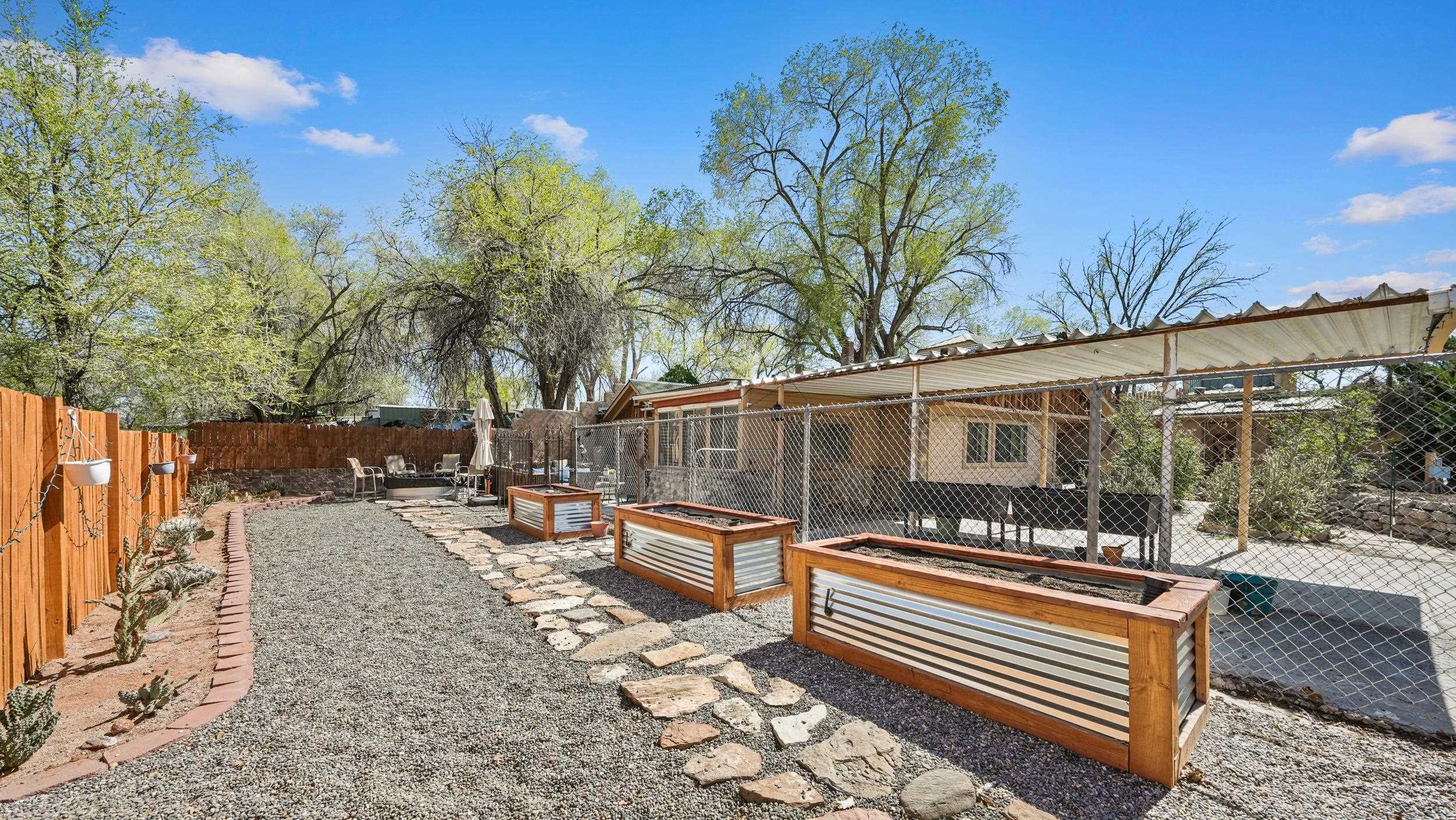 2518 D Road Grand Junction, CO 81507 - Photo 33 of 42 a backyard of a house with barbeque oven table and chairs